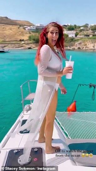 Boats and friends: Stacey channelled her inner mermaid at sea with her deep red hair, which flowed in the breeze