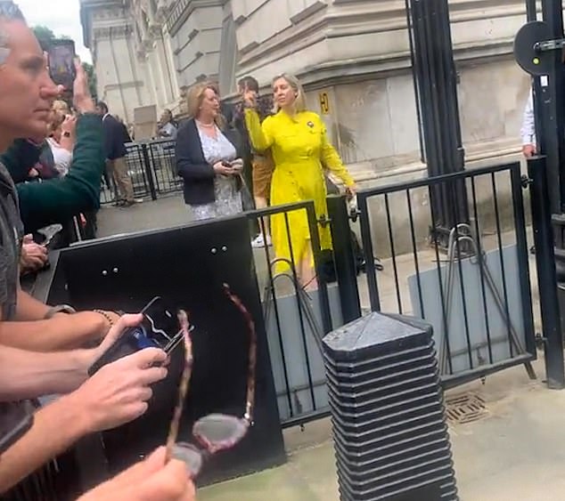 The Tory MP for Morley and Outwood, made the sign with her hand as she walked through the black gates yesterday afternoon, prior to being named education minister