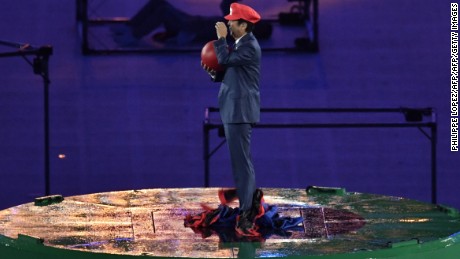 Shinzo Abe, dressed as Super Mario, holds a red ball during the closing ceremony of the Rio 2016 Olympic Games.