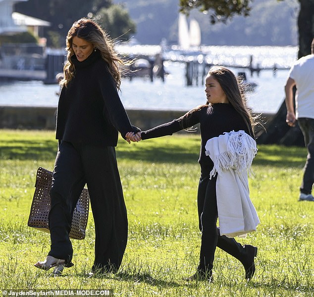 The 37-year-old dressed warmly for the chilly weather as the pair entered the park in Sydney's upmarket Double Bay