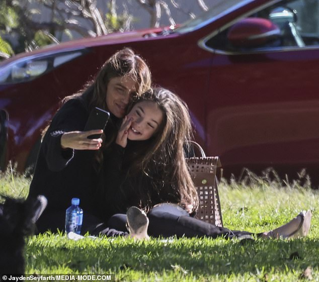 Jodi couldn't help but give her daughter a big cuddle as they sat together enjoying their meal