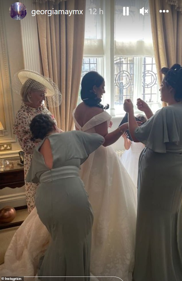 Stunning: Maddie looked sensational for the day as she donned a classic white off the shoulder dress with a sweetheart neckline and flowing train