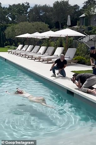 The cameras flashed as she took a dip inside her swimming pool