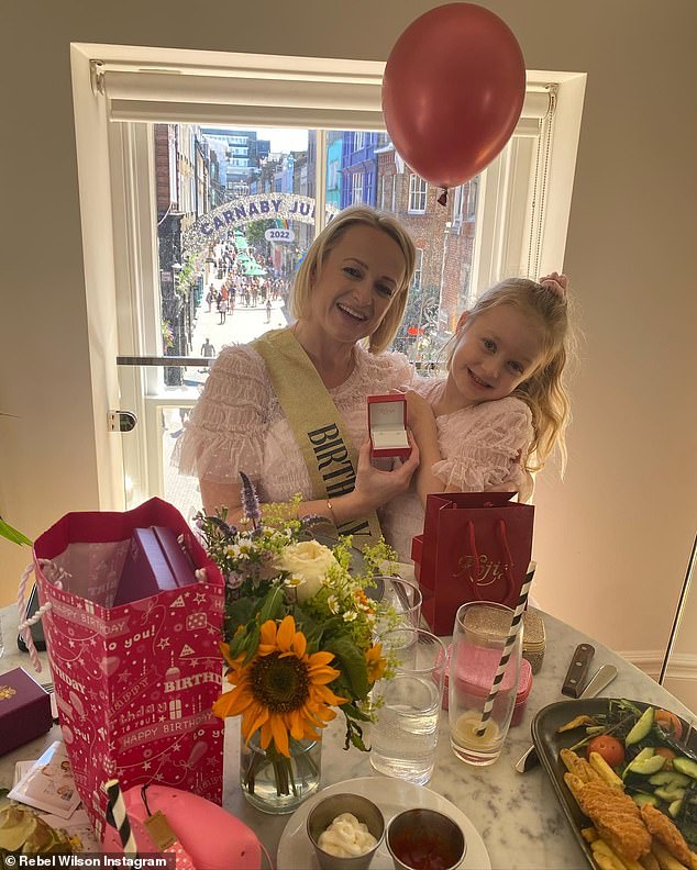 Gifts! Rebel (born Melanie Bownds) shared a slideshow of snaps of the beagle breeder wearing a 'birthday girl' sash and posing with one of her many presents, a pair of earrings