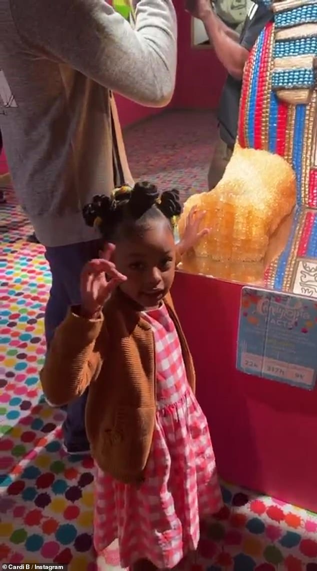 Special occasion: The 29-year-old performer spent a bit of quality time with her husband Offset, 30, and their children Kulture, four, and Wave, ten months, as they made their way around the exhibit and celebrated the former's birthday