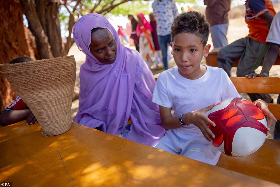 Lookalike: Sir Mo's mother Ahmed and his son Hussein Farah are pictured during filming for the documentary in Somaliland