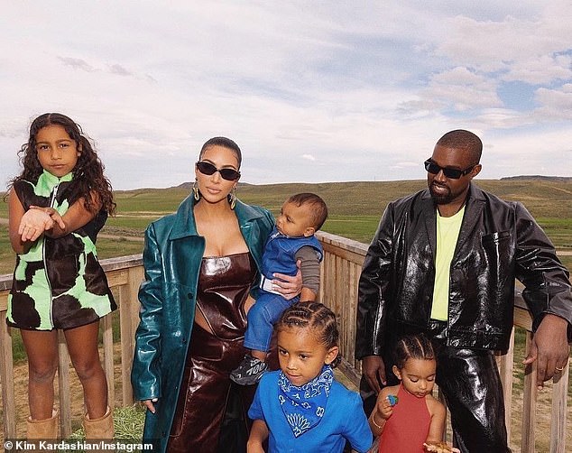 2020 family portrait: Kim and her estranged third husband - 24-time Grammy winner Kanye 'Ye' West (R) - were legally declared single on March 2, and their next status conference divorce hearing is scheduled for August 5