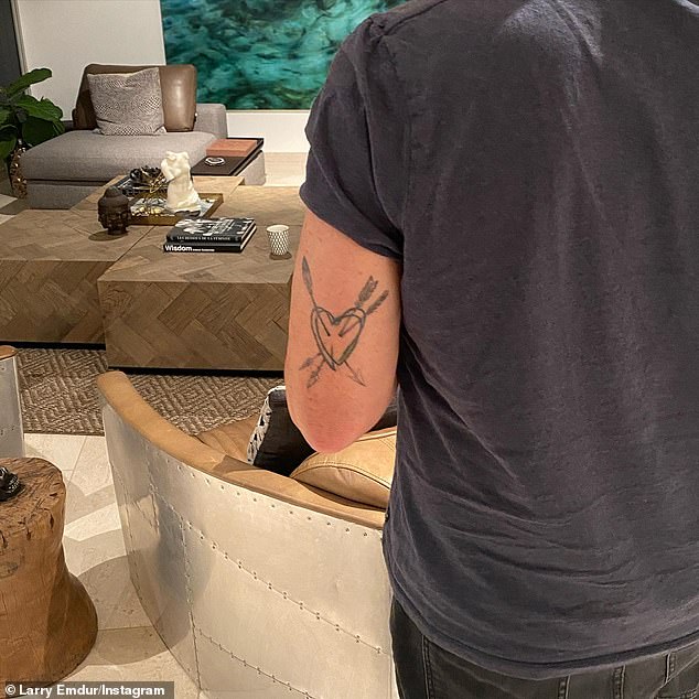 The 57-year-old's tattoo is of a heart with three arrows, done in black ink and in a hand drawn style. 'New ink story. My heart with an arrow for Sylvie, an arrow for Jye and an arrow for Tia #Family,' he wrote in the caption