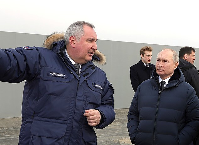 Vladimir Putin's space chief Dmitry Rogozin (left) inspects the giant weapon