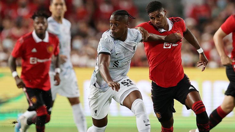 Isaac Mabaya competes for the ball against Marcus Rashford