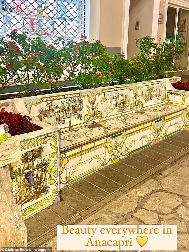 Having a ball: Over the course of her Insta Stories she threw in a snap of a lavishly designed outdoor tile bench as an example of 'Beauty everywhere in Anacapri'