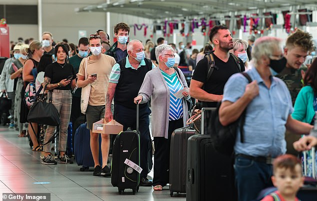 Qantas cancelled 6.7 per cent of flights and had an on-time performance of 44 per cent in July (pictured, a queue at Sydney Airport's domestic terminal)