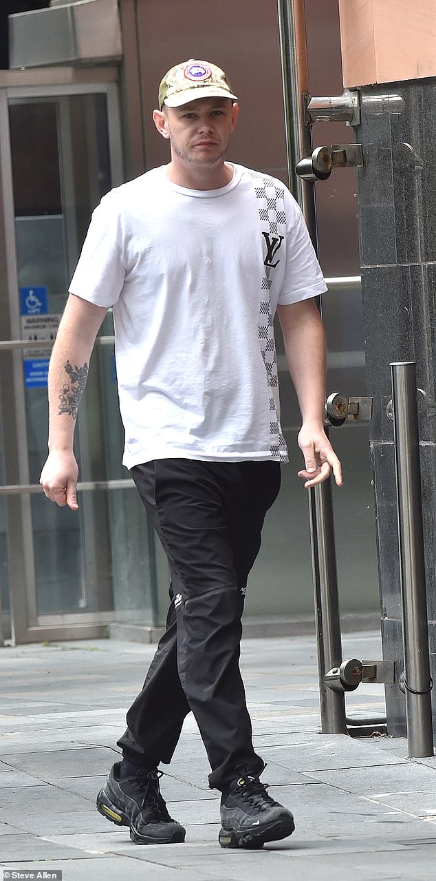 Crutchley is pictured outside Manchester Magistrates' Court on Thursday where he was fined more than £300 after admitting being drunk on an aircraft and assaulting an emergency worker