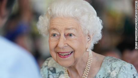 The Queen smiles on her Friday visit.