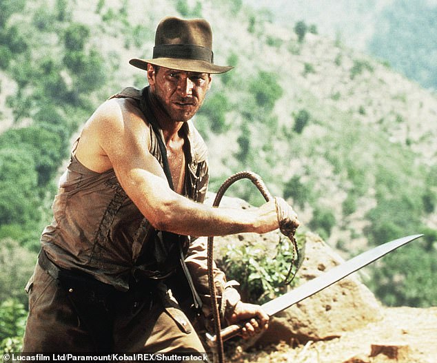 Coming: The fifth film in the adventures of Indiana Jones is set to premiere in theaters on June 30, 2023; Ford is pictured in a scene from Indiana Jones And The Temple Of Doom (1984)