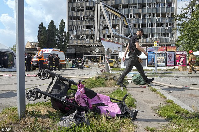 A Russia Kalibre cruise missile slammed into this office block in Vinnystya, which is hundreds of miles from the closest front line, as Liza and Irina walked past - peppering them both with shrapnel