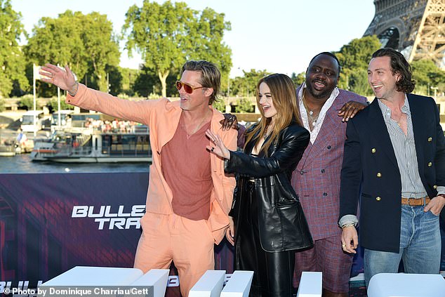 Outing: Joey King, who stars in the film opposite Brad, was among those posing for snaps in the French capital