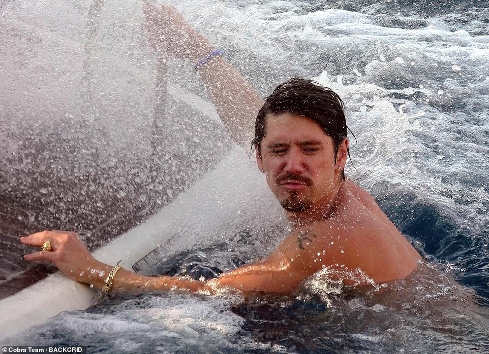 Having a splashing time: Bryan got involved but didn't bother with a wetsuit