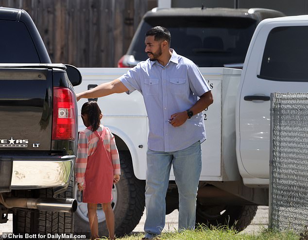 Upon leaving the morning mass, the casually-dressed deputy opened the door of his black Chevy Silverado for his young daughter