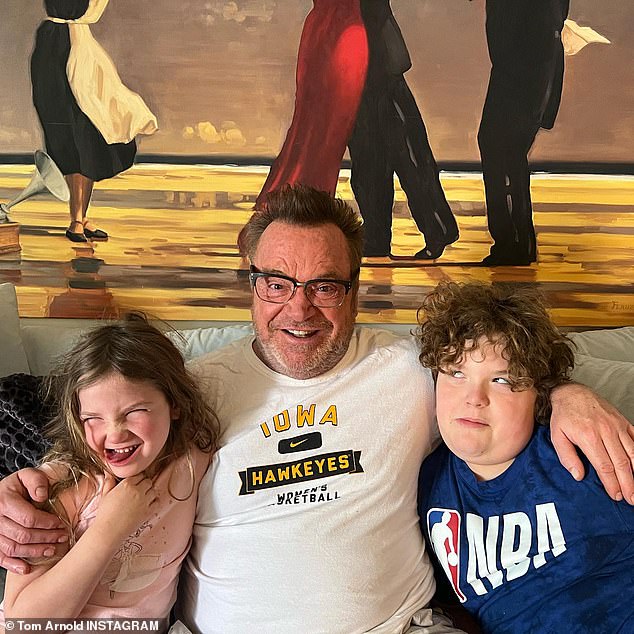 'I was giving the kids a bath and turned around to count to 10 ¿ it's what I do to get my kids out of the bathtub ¿ when suddenly my vision in my right eye went black, as if there was a curtain coming down,' the comedian explained. Tom seen with son Jax Copeland, nine, and daughter Quinn Sophie, six