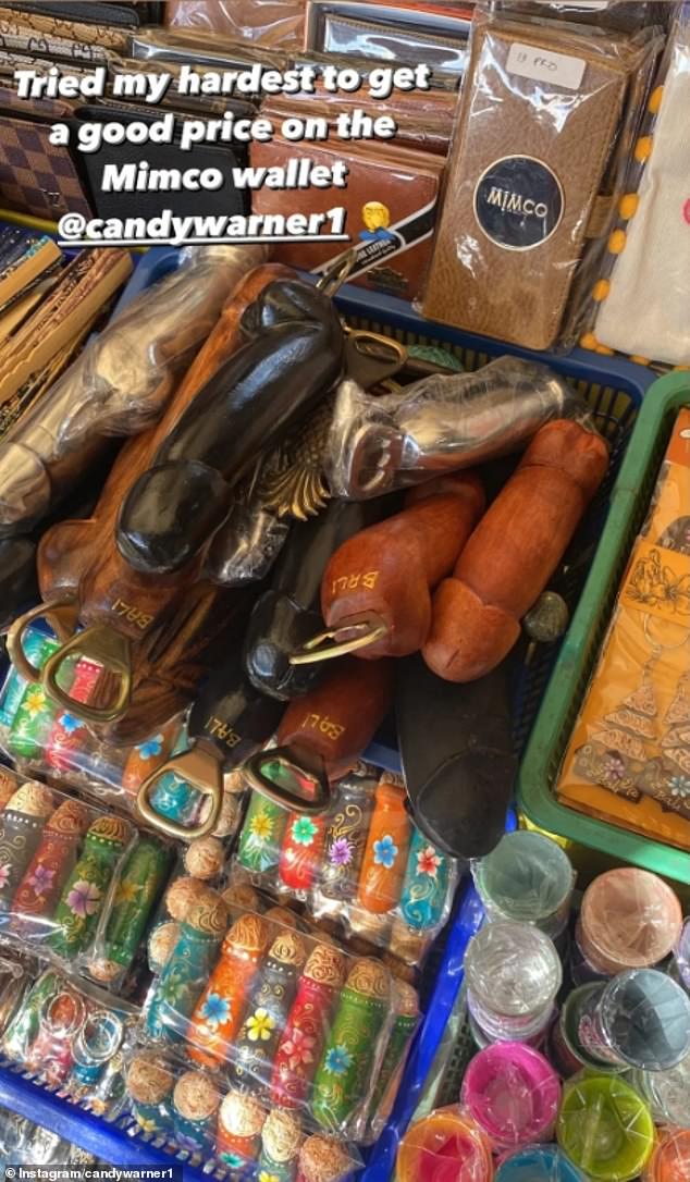 Posting to Instagram Stories on Tuesday, David shared this photo of a local market stall laden with knock-off designer brand wallets. 'Tried my hardest to get a good price on the Mimco wallet,' he captioned the image