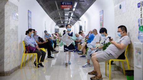 Residents spend their time in an air-raid shelter to escape summer heat amid a heat wave warning in Nanjing, Jiangsu province on July 12.