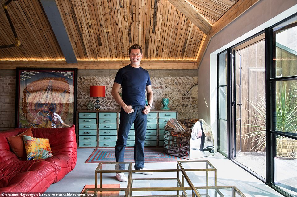 The main room at the top of the property also featured a poured concrete floor and a wooden ceiling, along with a wall of floor-to-ceiling windows