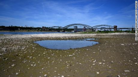 A puddle of water in the nearly dried-up river bed of the Rhine in Cologne, western Germany.