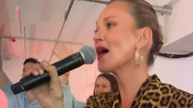 Sensational: The supermodel was seen entertaining guests as she broke into song