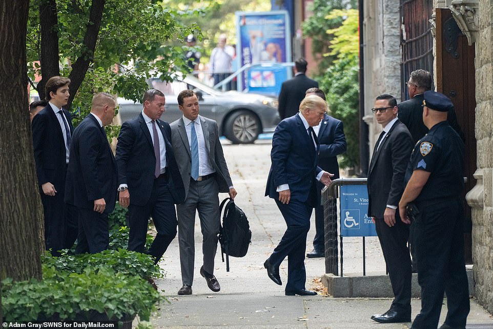 Donald Trump entering the church after Melania. Barron, 16, trailed behind him and their Secret Service entourage