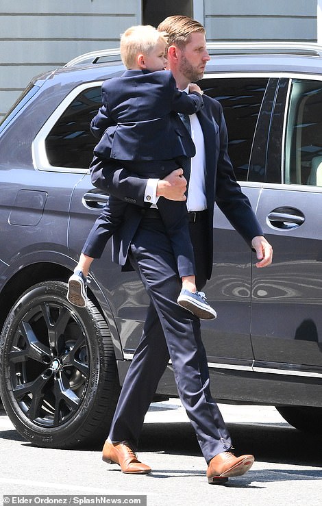 Eric Trump with his four-year-old son, also called Eric, at the funeral home