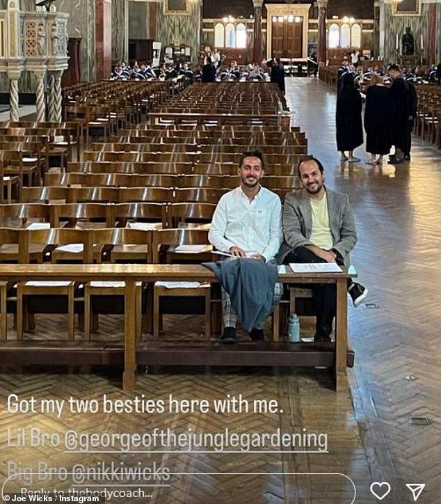 Proud: His two brothers sat in the front row as they were eager to see Joe receive his honorary doctorate