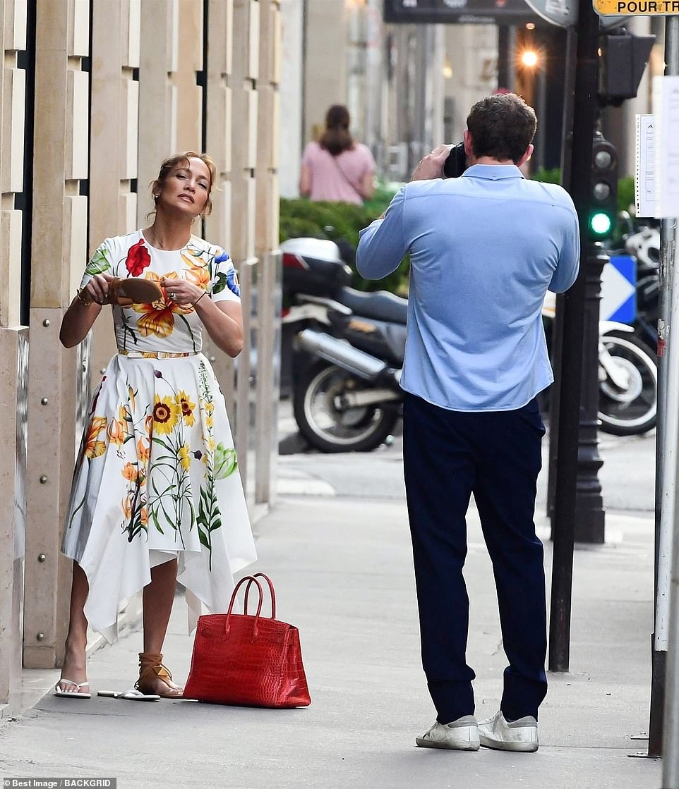 Paparazzi! Ben also proved himself to be every inch the doting husband as he was seen snapping glamorous pictures of Jennifer during their outing in the French capital