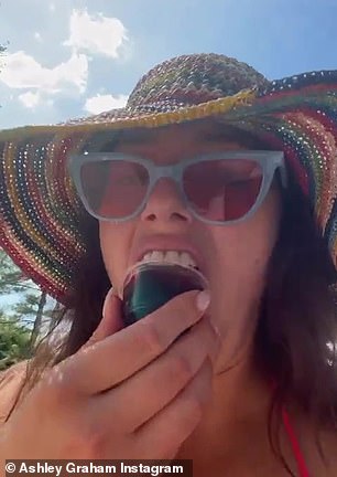 Cheers! She enjoyed a jello shot while relaxing by the pool