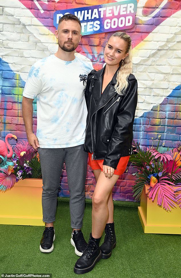 Looking good: The actor cut a casual figure in a white and blue T-shirt paired with grey jeans, while Kerry wowed in a red mini dress and a black leather jacket