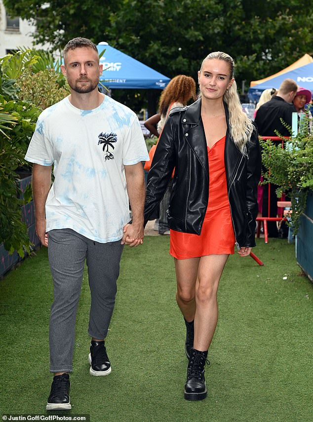 Close: The couple held hands as they strolled during their rare public appearance