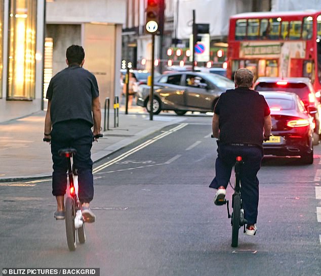 They then threw caution to the wind as they cycled off without helmets on matching electric bikes amid busy traffic in the capital