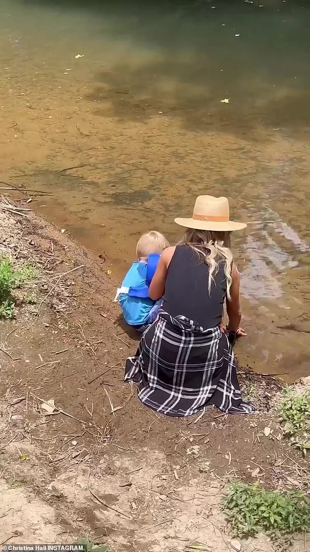 Making a splash: Christina played with Hudson by a creek