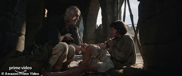 Unspeakable evil: A beggar then grabs a scared child's hand and inquires, 'have you heard of him, lad? Have you heard of Sauron?,' to which the latter pulls his arm away