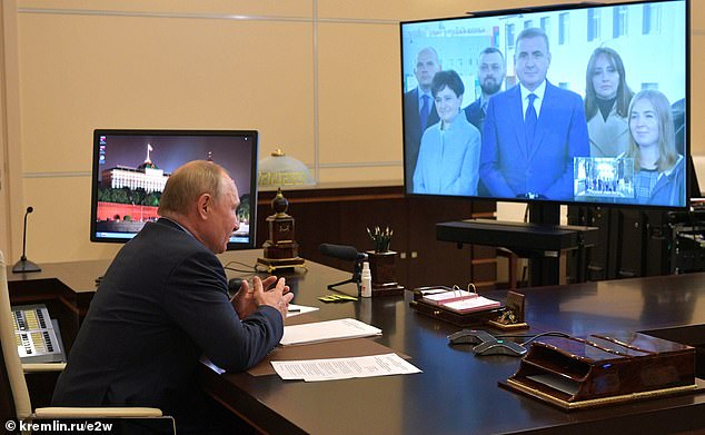 Putin's ex-bodyguard Alexey Dyumin (pictured speaking with Putin) - governor of Tula region where the bureau is based - said Konoplev 'has done a lot for the country's defence industry'