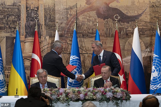 Turkish President Erdogan, right, and U.N. Secretary General Guterres, left sit as Russian defence minister Sergei Shoigu shakes hands with Turkish Defence Minister Hulusi Akar at Dolmabahce Palace in Istanbul