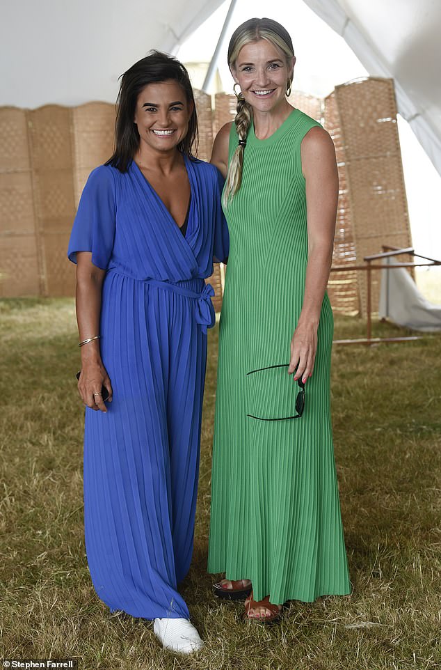 Blonde beauty: Posing with guests, her golden locks were styled in a side plait