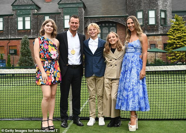 The couple, who sources say have 'never been more in love', had wanted to relive their special day for a while, the publication claimed. (Pictured: Lleyton and Bec with their daughters Mia, 16, and Ava, 11, and son Cruz, 13, at the International Tennis Hall of Fame on July 16)