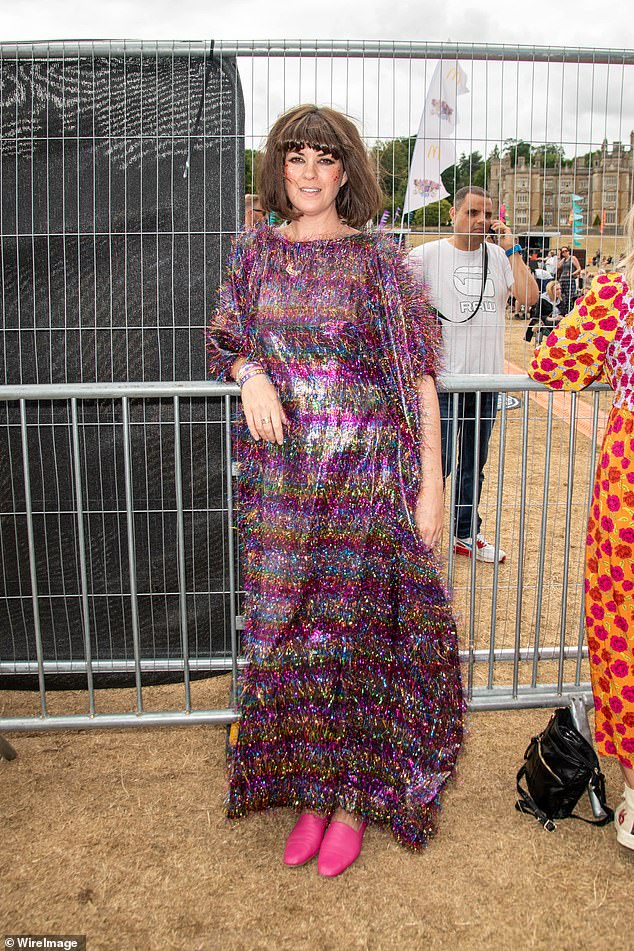 Wow! Dawn O'Porter, who also counted the late star as a dear pal, commanded attention in a fluffy purple maxi dress with yellow, blue and pink shimmering stripes