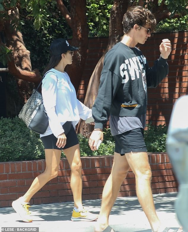 Matching: His acquaintance sported at trucker cap with the same screenprint on the front and word 'sweet' written across the front, a white sweatshirt and black shorts.