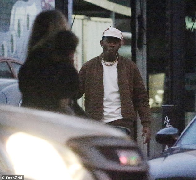 The See You Again star, 31, whose real name is Tyler Gregory Okonma, kept warm in a dark brown jacket and black pants