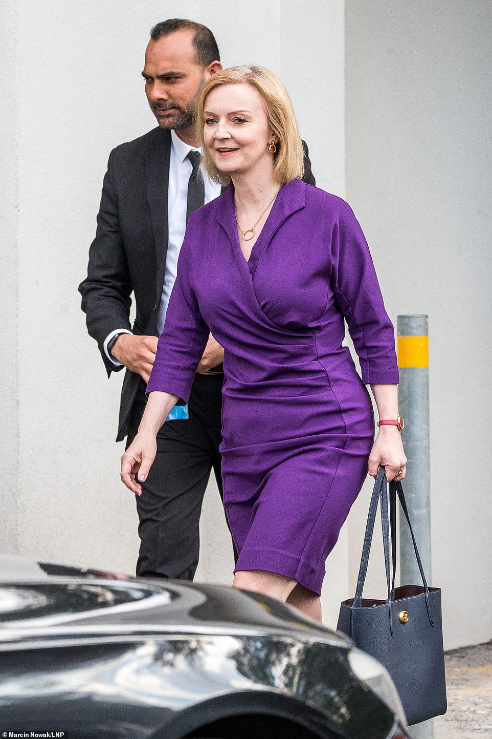 A worried Liz Truss reacts as a large crash was heard in the TalkTV studio during her live debate with Rishi Sunak