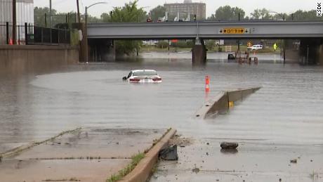 A car is submerged in flood waters after St. Louis recieved record-breaking rainfall Tuesday.