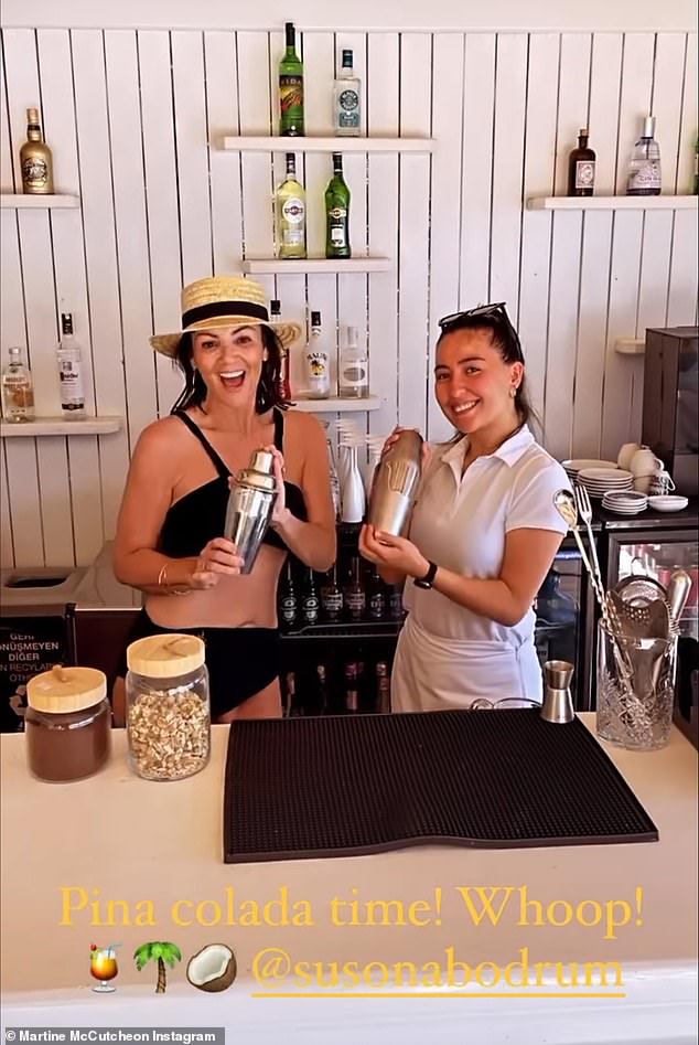 Drinks time: She was joined by one of the local barmaids for the six second clip who appeared to be giving Martine some advice on how to mix the perfect alcoholic beverage