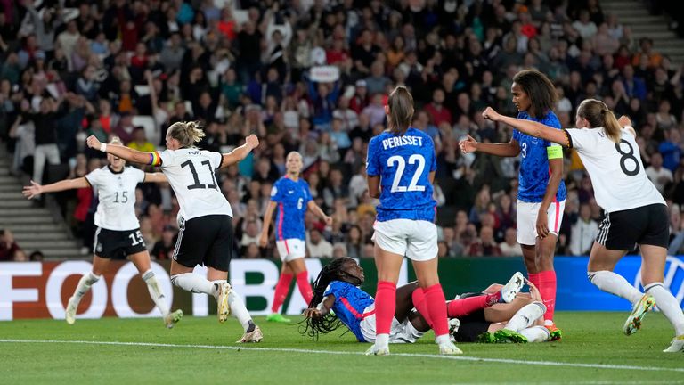 Germany&#39;s Alexandra Popp wheels off to celebrate after scoring her side&#39;s second goal against France